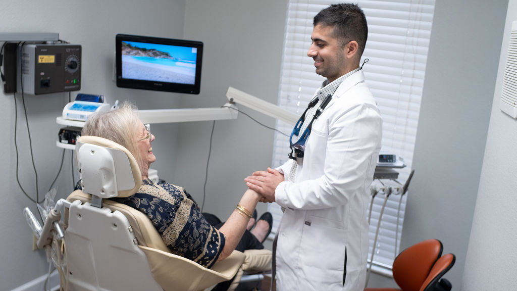 woman visiting a dentist in plant city because she doesn't need to see a specialist, like an endodontist or orthodontist in plant city